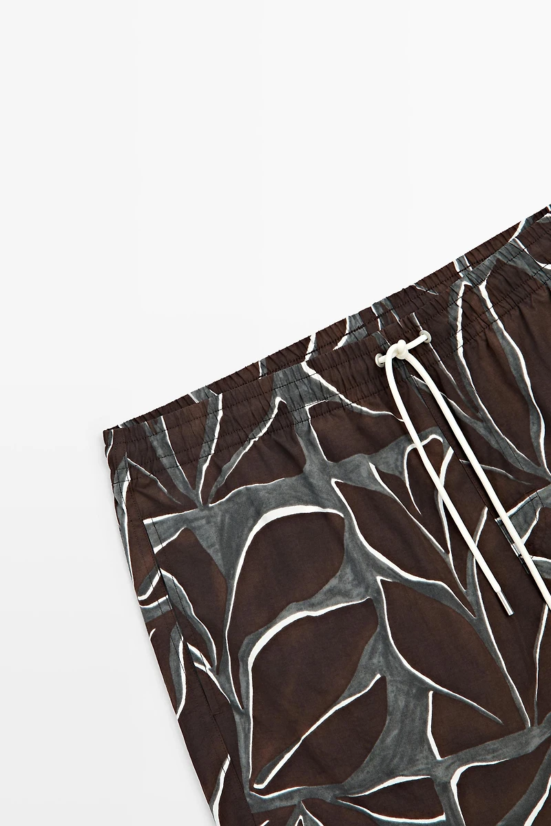 Tropical print swimming trunks