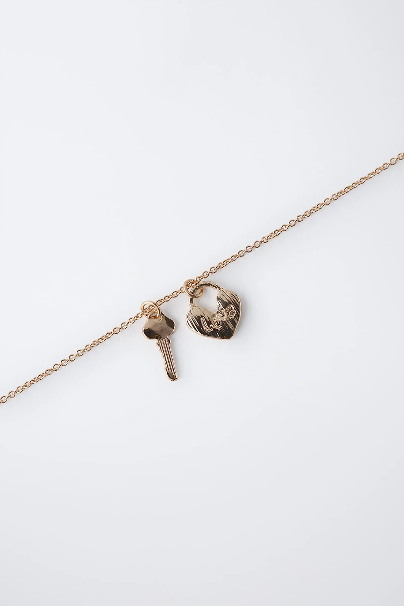 PACK OF TWO FLOCKED RABBIT AND PADLOCK NECKLACES