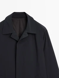 Lightweight trench coat with hidden buttons