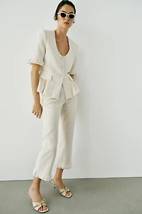 PANTALON MINI FLARE VOLANTS