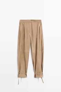 Suede leather pants with tie-detail hems