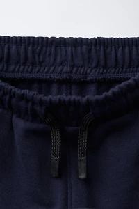 PANTALON DE JOGGING AVEC INSCRIPTION IMPRIMÉE