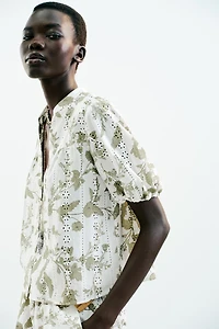 PRINTED TOP WITH EMBROIDERED EYELETS