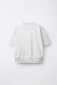 SWEAT MANCHES COURTES INSCRIPTION EN RELIEF