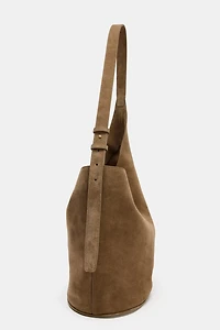 ASYMMETRIC LEATHER BUCKET BAG