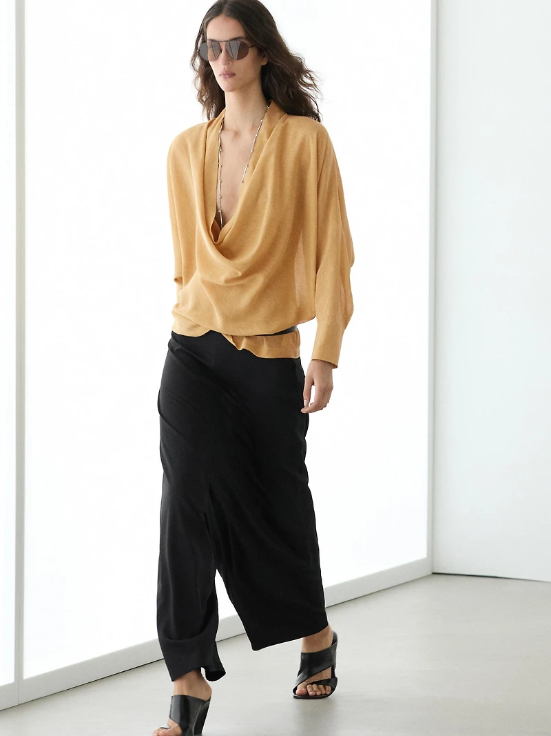 Flowing blouse with draped neckline