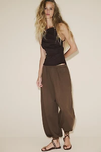 OPEN-BACK PLEATED TOP