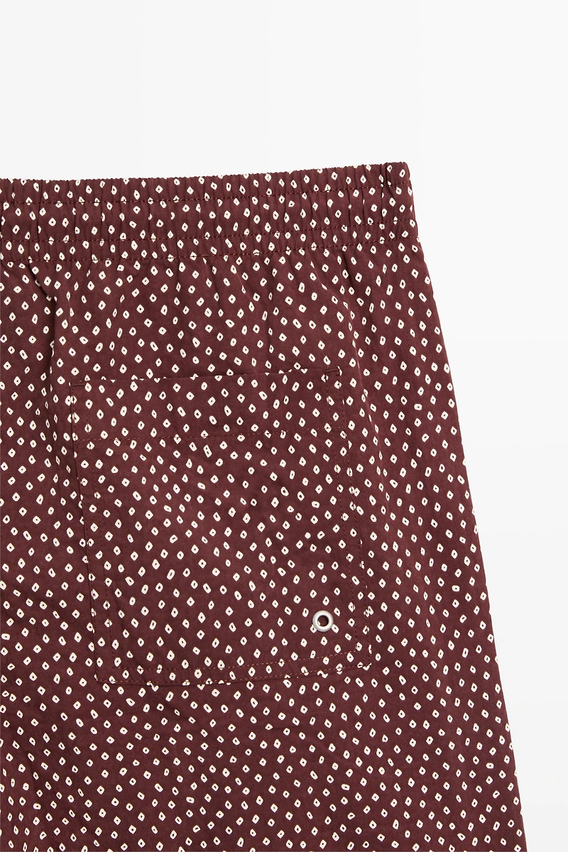 Polka dot print swimming trunks