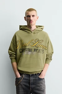 WASHED PRINTED TEXT SWEATSHIRT