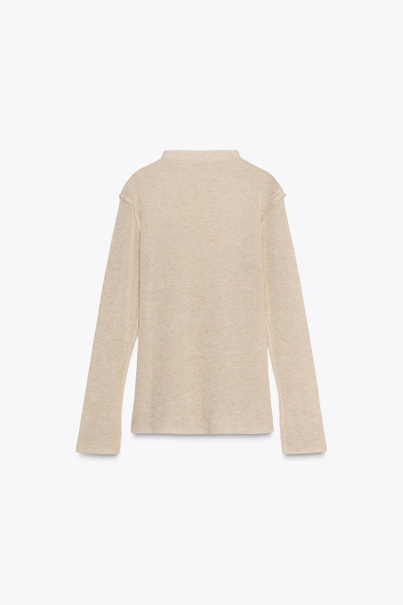 PULL EN MAILLE À COL CHEMINÉE