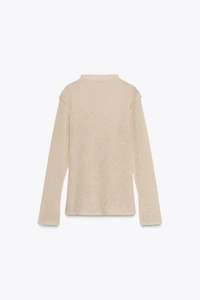PULL EN MAILLE À COL CHEMINÉE