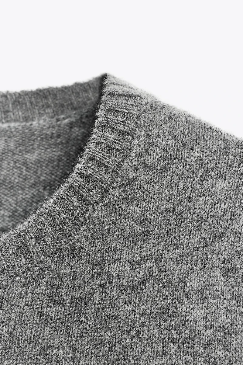 100% WOOL SHORT SLEEVE SWEATER