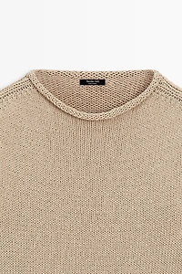 Pull en maille à manches courtes et col roulotté