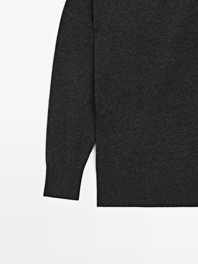 Wool blend knit sweater with asymmetric neckline