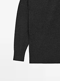 Wool blend knit sweater with asymmetric neckline