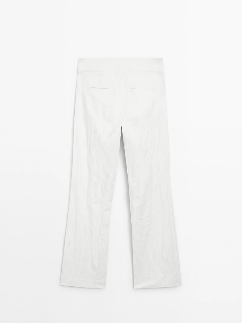 Pantalon slim taille basse avec boucles