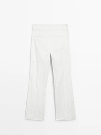 Pantalon slim taille basse avec boucles
