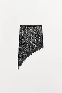 JUPE MI-LONGUE EN DENTELLE ASYMÉTRIQUE