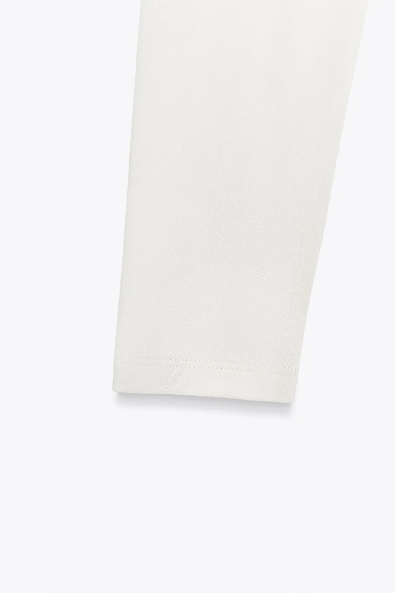 ASYMMETRIC LONG SLEEVE BODYSUIT