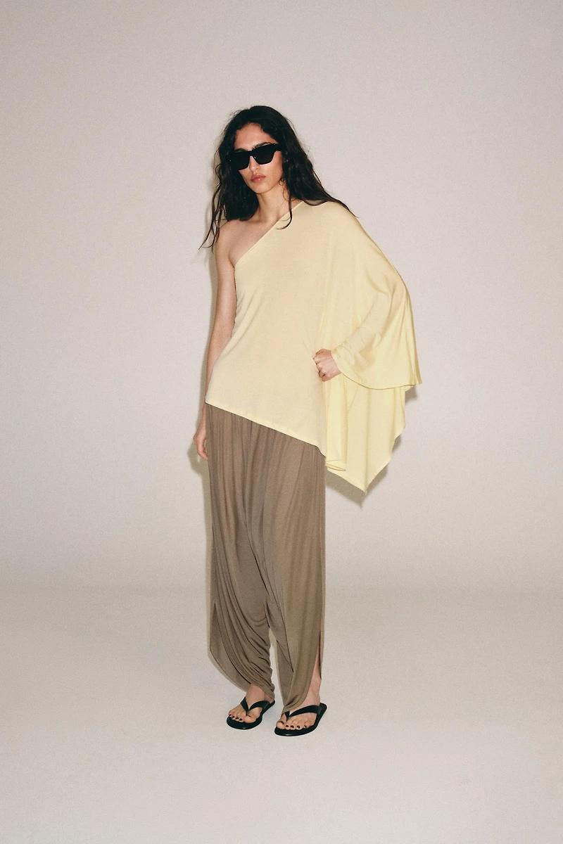 ASYMMETRIC CAPE