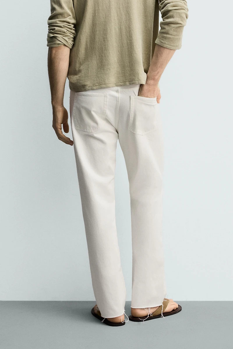 IRREGULAR HEM STRAIGHT FIT JEANS