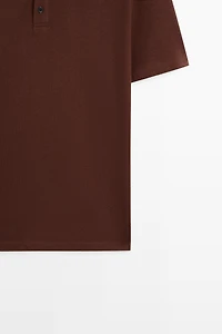 Polo micro-texturé en coton mélangé