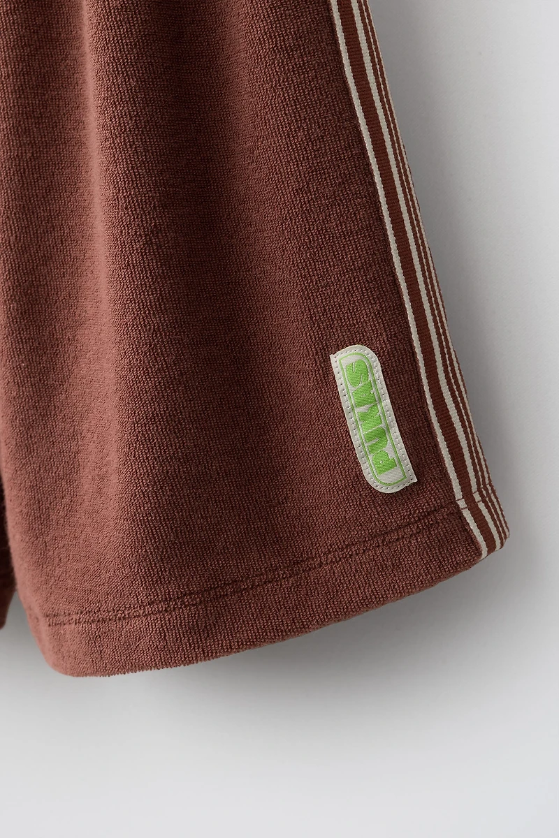 SHORT EN TISSU ÉPONGE PUKAS SURF