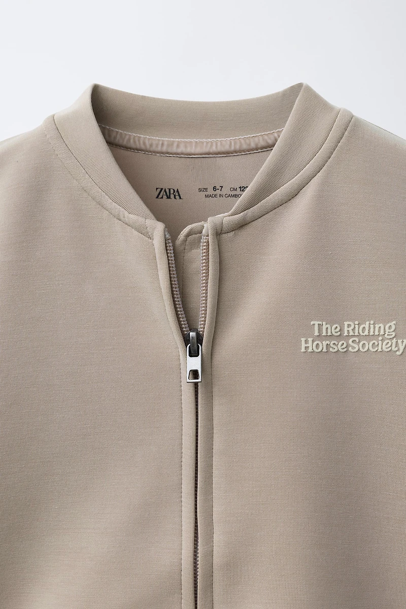 RAISED TEXT SWEATSHIRT