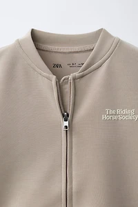 RAISED TEXT SWEATSHIRT