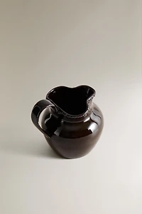 RAISED DESIGN STONEWARE JUG