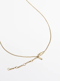 Necklace with metal piece