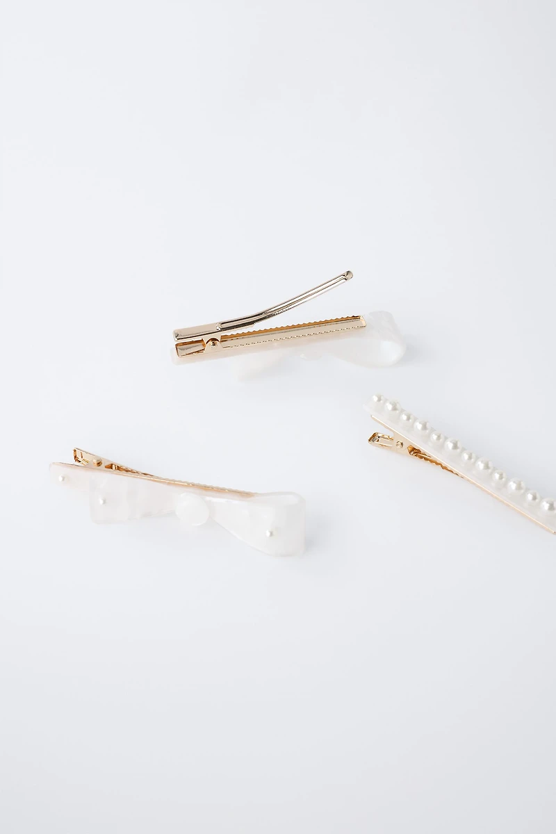 PACK OF THREE MOTHER-OF-PEARL HAIR CLIPS WITH BOWS AND PEARLS