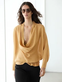 Flowing blouse with draped neckline