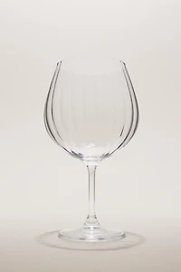 CRYSTALLINE GLASS WITH A RAISED DESIGN