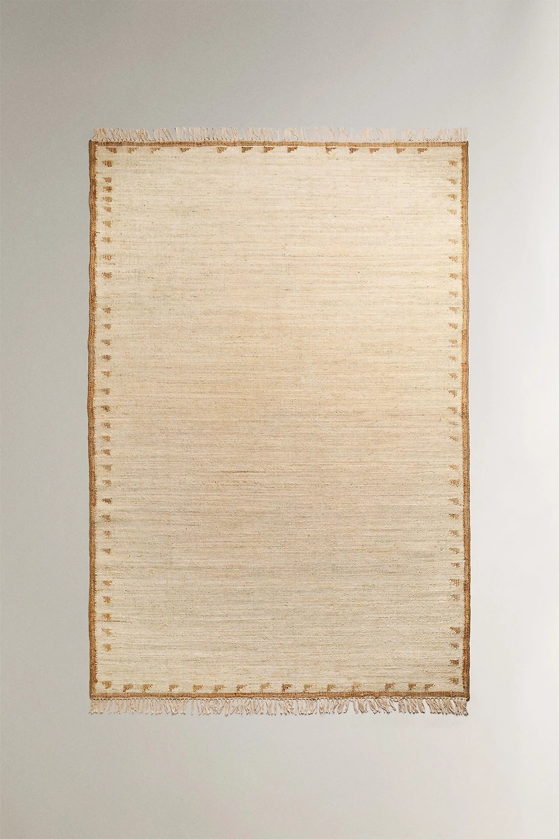JUTE AND COTTON AREA RUG WITH FRINGING