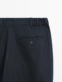 Tapered fit linen trousers