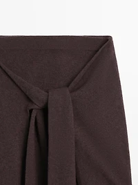 Knit skirt with knotted sleeve details