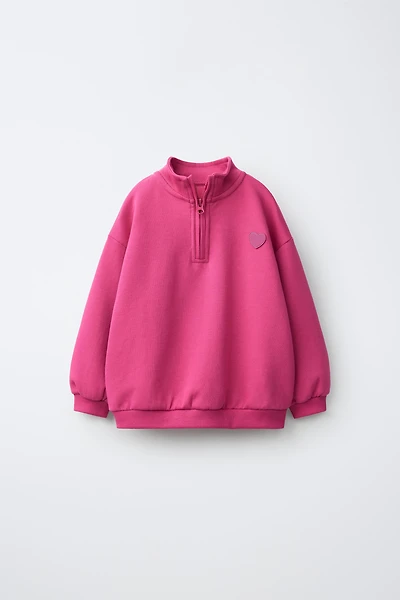 RUBBERIZED HEART INTERLOCK SWEATSHIRT