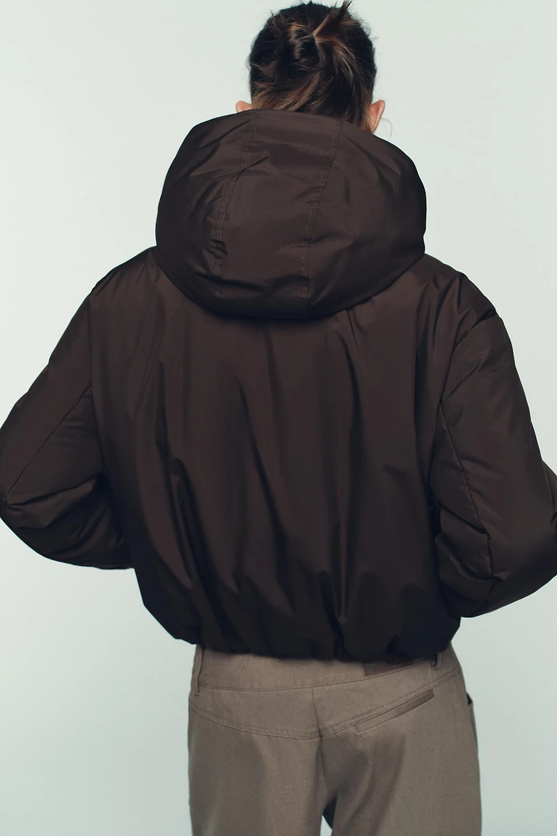 ANORAK MATELASSÉ À CAPUCHE DÉPERLANT COUPE-VENT