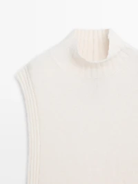 Sleeveless high neck sweater