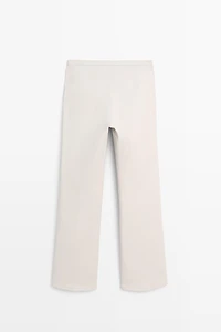Mid-waist waxed flared pants