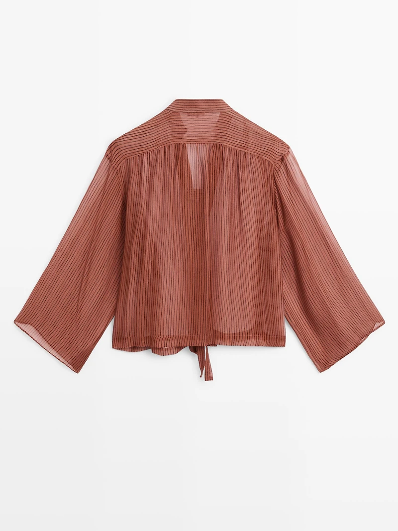 Chemisier semi-transparent avec nœud