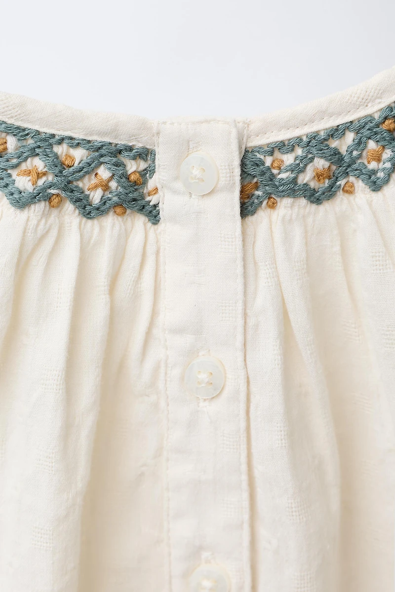 CONTRAST EMBROIDERED BODYSUIT