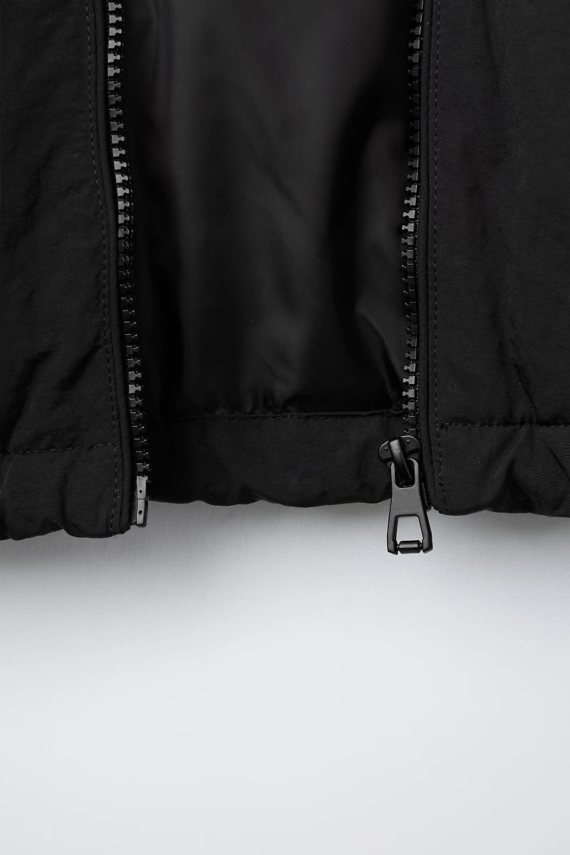 UEFA CHAMPIONS LEAGUE ® WATER REPELLENT JACKET WITH HOODIE