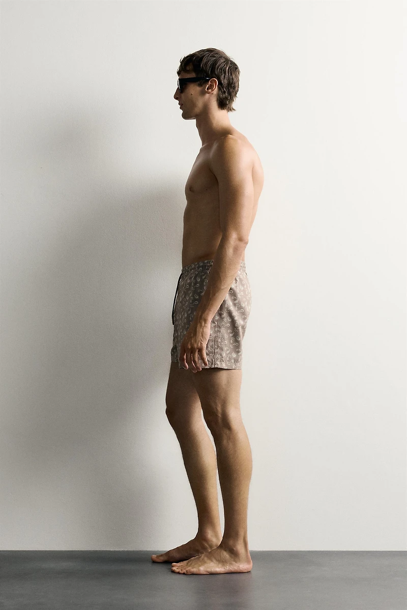 PAISLEY PRINT MID-LENGTH SWIM TRUNKS