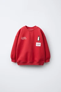 FLOCKED PENGUIN SWEATSHIRT