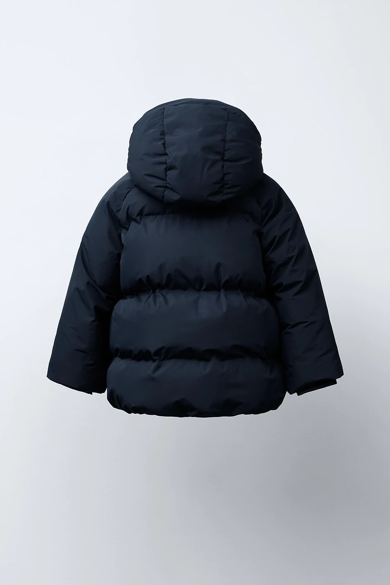 BLOUSON MATELASSÉ À CAPUCHE DÉPERLANT