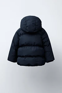 BLOUSON MATELASSÉ À CAPUCHE DÉPERLANT