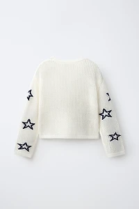 PULL EN RÉSILLE À IMPRIMÉ ÉTOILES