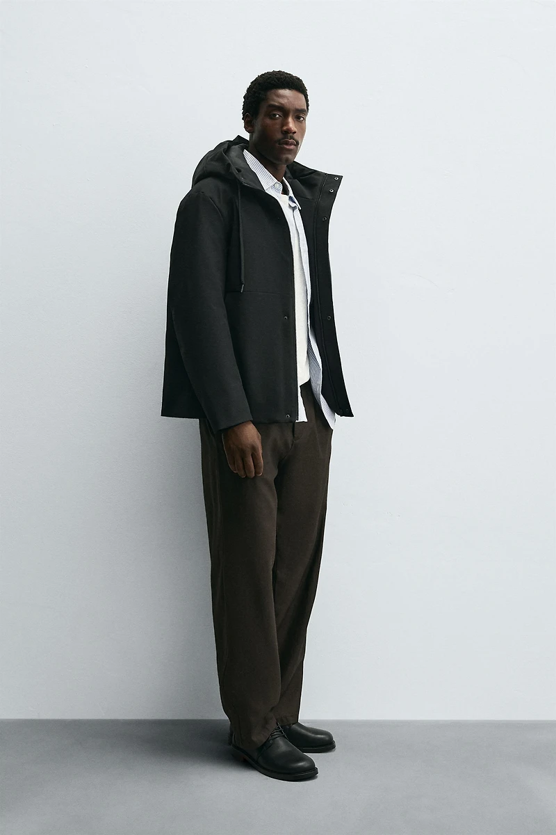 HOODED TECHNICAL JACKET